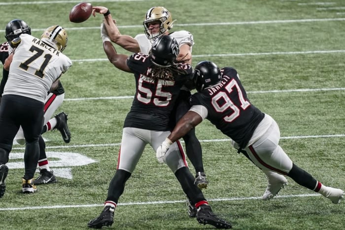 Falcons end Steven Means (55) hits Saints quarterback Taysom Hill (7) causing a fumble recovered by Atlanta. Mandatory Credit: Dale Zanine-USA TODAY Sports